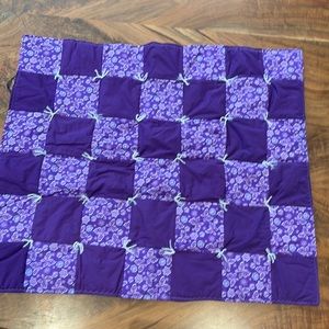 Vibrant Purple baby crib size quilt with butterflies and flowers.